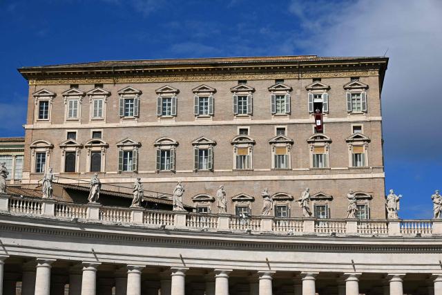 Pope Leo XIV addresses the crowd from the window of the apostolic palace overlooking St. Peter's square during the Angelus prayer in the Vatican on February 15, 2026. (Photo by Andreas SOLARO / AFP)
