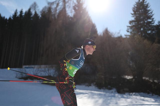 Germany's Friedrich Moch compete during the cross-country men's 4 x 7,5km relay event of the Milano Cortina 2026 Winter Olympic Games at Tesero Cross-Country Skiing Stadium in Lago di Tesero (Val di Fiemme), on February 15, 2026. (Photo by Anne-Christine POUJOULAT / AFP)