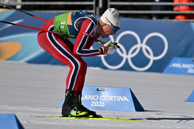 Norway's Martin Loewstroem Nyenget competes during the cross-country men's 4 x 7,5km relay event of the Milano Cortina 2026 Winter Olympic Games at Tesero Cross-Country Skiing Stadium in Lago di Tesero (Val di Fiemme), on February 15, 2026. (Photo by Javier SORIANO / AFP)