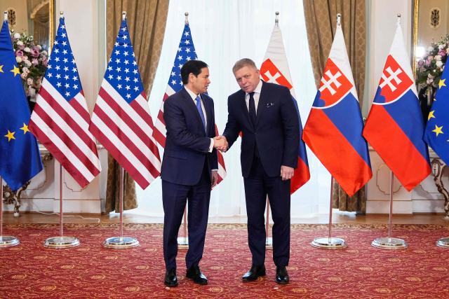 US Secretary of State Marco Rubio (L) shakes hands with Slovakia's Prime Minister Robert Fico as they meet in Bratislava, Slovakia, on February 15, 2026. (Photo by Alex Brandon / POOL / AFP)