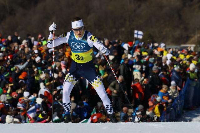 Sweden's William Poromaa competes during the cross-country men's 4 x 7,5km relay event of the Milano Cortina 2026 Winter Olympic Games at Tesero Cross-Country Skiing Stadium in Lago di Tesero (Val di Fiemme), on February 15, 2026. (Photo by Anne-Christine POUJOULAT / AFP)