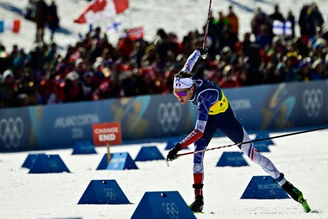 France's Mathis Desloges competes during the cross-country men's 4 x 7,5km relay event of the Milano Cortina 2026 Winter Olympic Games at Tesero Cross-Country Skiing Stadium in Lago di Tesero (Val di Fiemme), on February 15, 2026. (Photo by Tobias SCHWARZ / AFP)