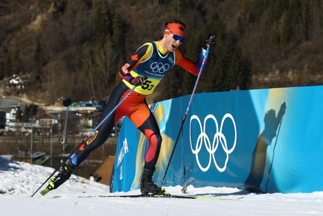 Canada's Remi Drolet competes during the cross-country men's 4 x 7,5km relay event of the Milano Cortina 2026 Winter Olympic Games at Tesero Cross-Country Skiing Stadium in Lago di Tesero (Val di Fiemme), on February 15, 2026. (Photo by Anne-Christine POUJOULAT / AFP)