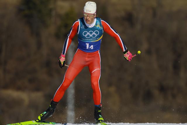 Norway's Johannes Hoesflot Klaebo competes during the cross-country men's 4 x 7,5km relay event of the Milano Cortina 2026 Winter Olympic Games at Tesero Cross-Country Skiing Stadium in Lago di Tesero (Val di Fiemme), on February 15, 2026. (Photo by Anne-Christine POUJOULAT / AFP)
