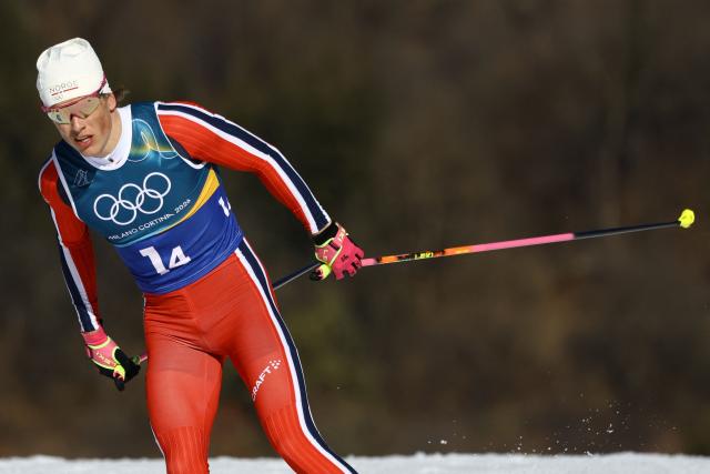 Norway's Johannes Hoesflot Klaebo competes during the cross-country men's 4 x 7,5km relay event of the Milano Cortina 2026 Winter Olympic Games at Tesero Cross-Country Skiing Stadium in Lago di Tesero (Val di Fiemme), on February 15, 2026. (Photo by Anne-Christine POUJOULAT / AFP)