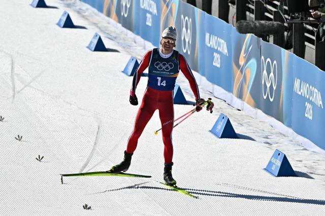 Norway's Johannes Hoesflot Klaebo reacts as he skies to the finish line to win the cross-country men's 4 x 7,5km relay event of the Milano Cortina 2026 Winter Olympic Games at Tesero Cross-Country Skiing Stadium in Lago di Tesero (Val di Fiemme), on February 15, 2026. (Photo by Javier SORIANO / AFP)