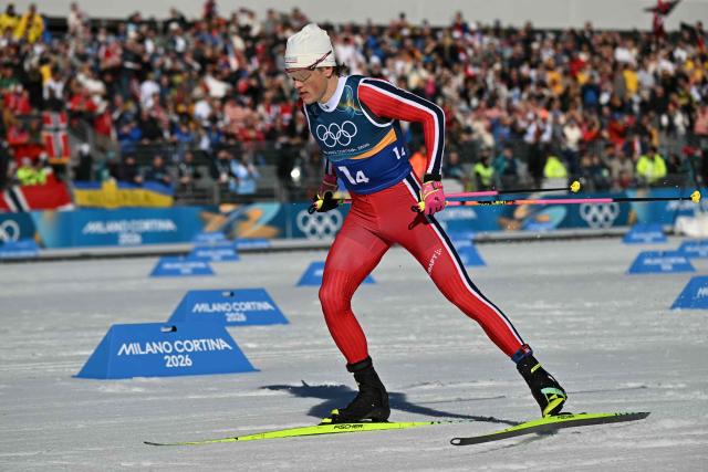 Norway's Johannes Hoesflot Klaebo competes during the cross-country men's 4 x 7,5km relay event of the Milano Cortina 2026 Winter Olympic Games at Tesero Cross-Country Skiing Stadium in Lago di Tesero (Val di Fiemme), on February 15, 2026. (Photo by Javier SORIANO / AFP)
