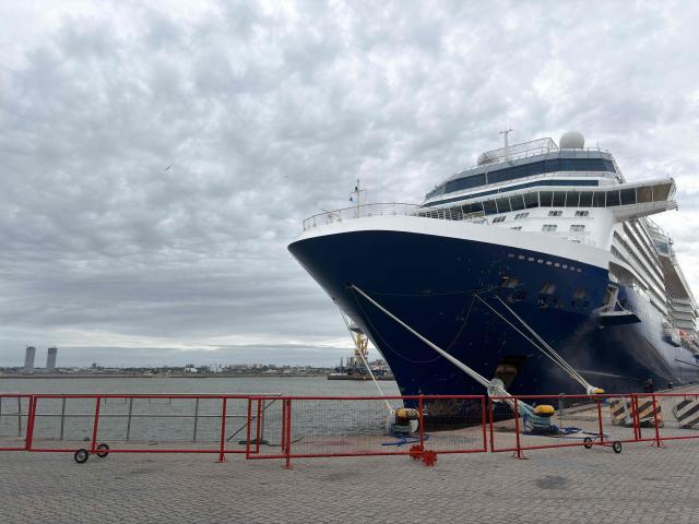 The Celebrity Equinox cruise ship remains moored at the port of Montevideo on February 15, 2026. (Photo by Ivanna INFANTOZZI / AFP)