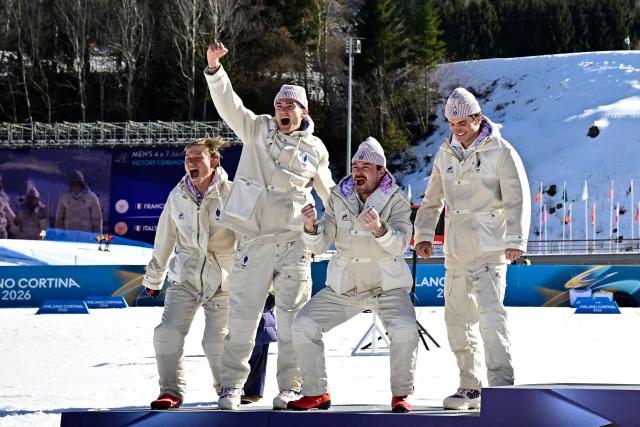 (From L) Silver medallists France's Victor Lovera, France's Mathis Desloges, France's Hugo Lapalus, France's Theo Schely celebrate on the podium for the cross-country men's 4 x 7,5km relay event of the Milano Cortina 2026 Winter Olympic Games at Tesero Cross-Country Skiing Stadium in Lago di Tesero (Val di Fiemme), on February 15, 2026. (Photo by Tobias SCHWARZ / AFP)
