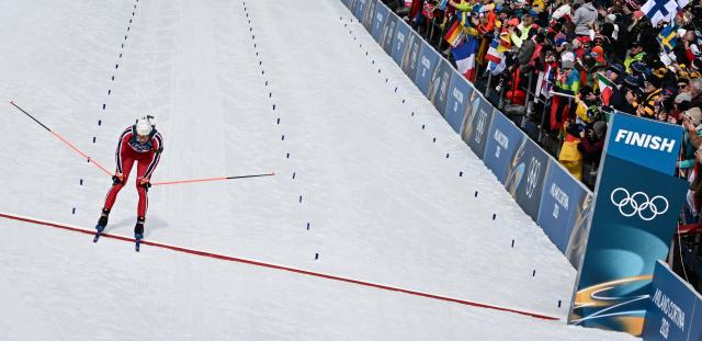 Norway's Vetle Sjaastad Christiansen reacts while crossing the finish line during the men's biathlon 12,5km pursuit event during the Milano Cortina 2026 Winter Olympic Games at the Anterselva Biathlon Arena (Sudtirol Arena) in Anterselva (Val Pusteria) on February 15, 2026. (Photo by Franck FIFE / AFP)