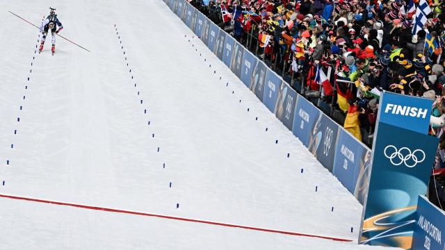 France's Emilien Jacquelin reacts while crossing the finish line during the men's biathlon 12,5km pursuit event during the Milano Cortina 2026 Winter Olympic Games at the Anterselva Biathlon Arena (Sudtirol Arena) in Anterselva (Val Pusteria) on February 15, 2026. (Photo by Franck FIFE / AFP)