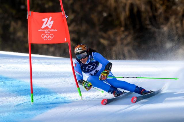 Italy's Federica Brignone competes in the second run of the women's giant slalom event during the Milano Cortina 2026 Winter Olympic Games at the Tofane Alpine Skiing Centre in Cortina d’Ampezzo on February 15, 2026. (Photo by Marco BERTORELLO / AFP)