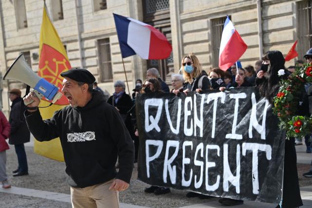 Activist of the far-right identitarian movement 'Ligue du Midi' Olivier Roudier shouts in a megaphone in Montpellier, southern France, on February 15, 2026, during a rally after the fatal beating of a 23-year-old Quentin. French President Emmanuel Macron on February 14, 2026 urged calm and restraint after the fatal beating of a 23-year-old French youth aligned with the far-right on the sidelines of a conference by a hard-left lawmaker in the southeastern city of Lyon. The death of the young man -- identified only as Quentin -- has intensified tensions between France's far-right and hard-left who are both eyeing 2027 presidential elections. (Photo by Sylvain THOMAS / AFP)