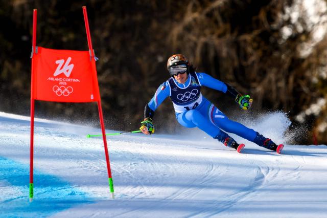 Italy's Federica Brignone competes in the second run of the women's giant slalom event during the Milano Cortina 2026 Winter Olympic Games at the Tofane Alpine Skiing Centre in Cortina d’Ampezzo on February 15, 2026. (Photo by Marco BERTORELLO / AFP)