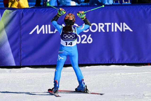 taly's Federica Brignone celebrates in the finish area after winning  the women's giant slalom event during the Milano Cortina 2026 Winter Olympic Games at the Tofane Alpine Skiing Centre in Cortina d’Ampezzo on February 15, 2026. (Photo by Stefano RELLANDINI / AFP)