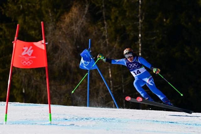 Italy's Federica Brignone competes in the second run of the women's giant slalom event during the Milano Cortina 2026 Winter Olympic Games at the Tofane Alpine Skiing Centre in Cortina d’Ampezzo on February 15, 2026. (Photo by Stefano RELLANDINI / AFP)