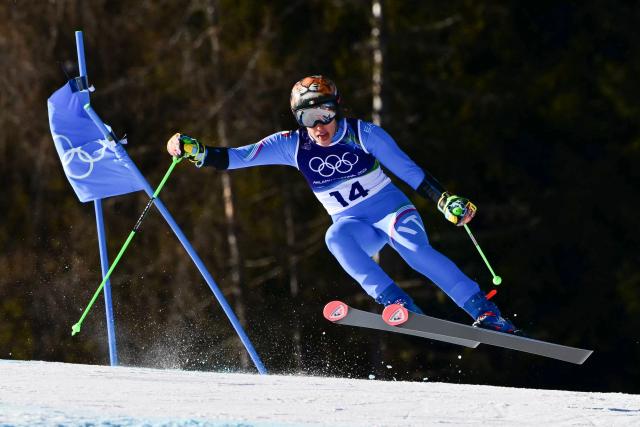 TOPSHOT - Italy's Federica Brignone competes in the second run of the women's giant slalom event during the Milano Cortina 2026 Winter Olympic Games at the Tofane Alpine Skiing Centre in Cortina d’Ampezzo on February 15, 2026. (Photo by Stefano RELLANDINI / AFP)
