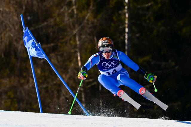 Italy's Federica Brignone competes in the second run of the women's giant slalom event during the Milano Cortina 2026 Winter Olympic Games at the Tofane Alpine Skiing Centre in Cortina d’Ampezzo on February 15, 2026. (Photo by Stefano RELLANDINI / AFP)