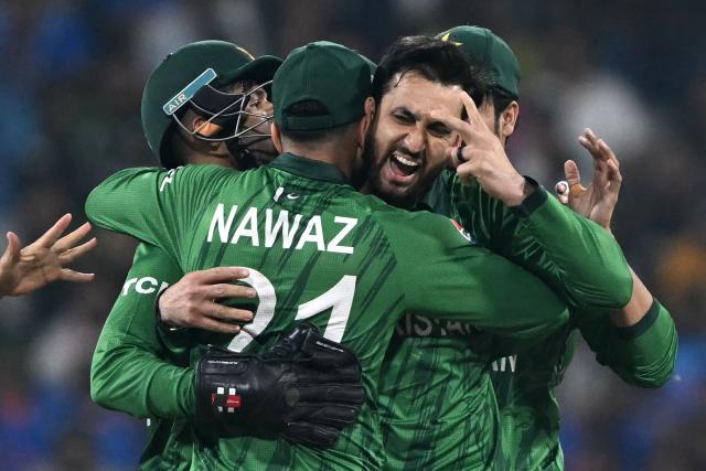 Pakistan's captain Salman Agha (R) celebrates with teammates after taking the wicket of India's Abhishek Sharma during the 2026 ICC Men's T20 Cricket World Cup group stage match between India and Pakistan at the R Premadasa Stadium in Colombo on February 15, 2026. (Photo by Ishara S. KODIKARA / AFP)