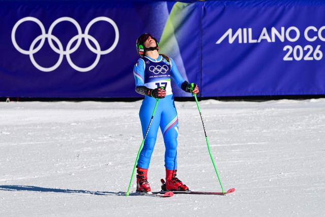 Italy's Sofia Goggia reacts in the finish area after competing in the second run of the women's giant slalom event during the Milano Cortina 2026 Winter Olympic Games at the Tofane Alpine Skiing Centre in Cortina d’Ampezzo on February 15, 2026. (Photo by Stefano RELLANDINI / AFP)