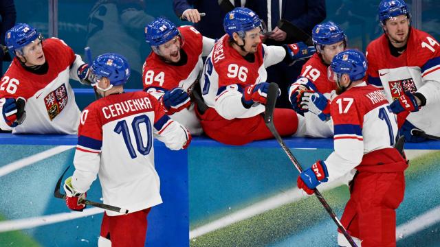 (From L) Czech Republic's #10 Roman Cervenka and Czech Republic's #17 Filip Hronek celebrate their team's third goal with team mates during men's preliminary round Group A Ice Hockey match between Switzerland and Czech Republic at the Milano Santagiulia Ice Hockey Arena during the Milano Cortina 2026 Winter Olympic Games in Milan, on February 15, 2026. (Photo by Alexander NEMENOV / AFP)