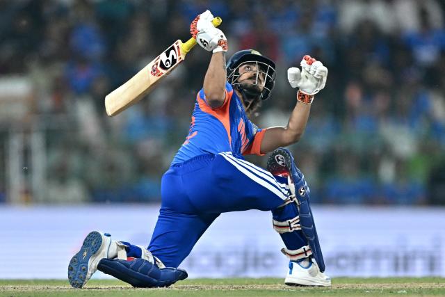 India's Ishan Kishan watches the ball after playing a shot during the 2026 ICC Men's T20 Cricket World Cup group stage match between India and Pakistan at the R Premadasa Stadium in Colombo on February 15, 2026. (Photo by Manan VATSYAYANA / AFP)