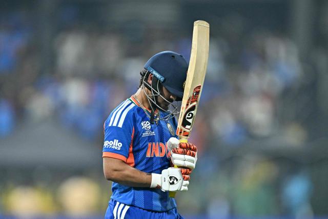 India's Ishan Kishan walks back to the pavilion after his dismissal during the 2026 ICC Men's T20 Cricket World Cup group stage match between India and Pakistan at the R Premadasa Stadium in Colombo on February 15, 2026. (Photo by Manan VATSYAYANA / AFP)