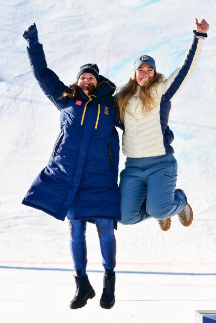 Tied silver medallists Sweden's Sara Hector (L) and Norway's Thea Louise Stjernesund celebrate on the podium of the women's giant slalom event during the Milano Cortina 2026 Winter Olympic Games at the Tofane Alpine Skiing Centre in Cortina d’Ampezzo on February 15, 2026. (Photo by Stefano RELLANDINI / AFP)