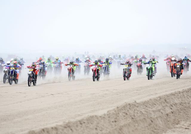 Participants compete in the 50th edition of the moto Enduropale event in Le Touquet Paris Plage on February 15, 2026. (Photo by Francois LO PRESTI / AFP)