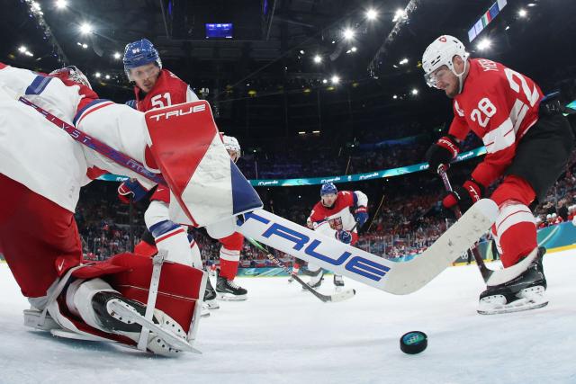 Switzerland's #28 Timo Meier (R) scores his team's second goal against Czech Republic's #01 Lukas Dostal during men's preliminary round Group A Ice Hockey match between Switzerland and Czech Republic at the Milano Santagiulia Ice Hockey Arena during the Milano Cortina 2026 Winter Olympic Games in Milan, on February 15, 2026. (Photo by POOL / AFP)