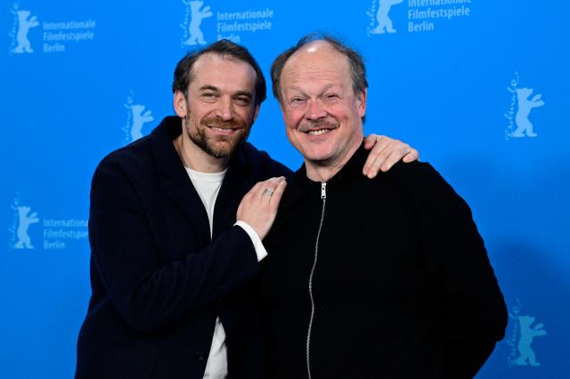 French actor Arieh Worthalter and Belgian actor Jan Hammenecker pose during a photo call for the film "Dust" presented in competition at the 76th Berlinale, Europe's first major film festival of the year, in Berlin on February 15, 2026. (Photo by John MACDOUGALL / AFP)