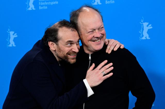 French actor Arieh Worthalter and Belgian actor Jan Hammenecker pose during a photo call for the film "Dust" presented in competition at the 76th Berlinale, Europe's first major film festival of the year, in Berlin on February 15, 2026. (Photo by John MACDOUGALL / AFP)