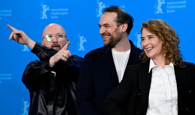 (From L) Belgian screenwriter Angelo Tijssens, French actor Arieh Worthalter and Belgian director Anke Blonde  pose during a photo call for the film "Dust" presented in competition at the 76th Berlinale, Europe's first major film festival of the year, in Berlin on February 15, 2026. (Photo by John MACDOUGALL / AFP)
