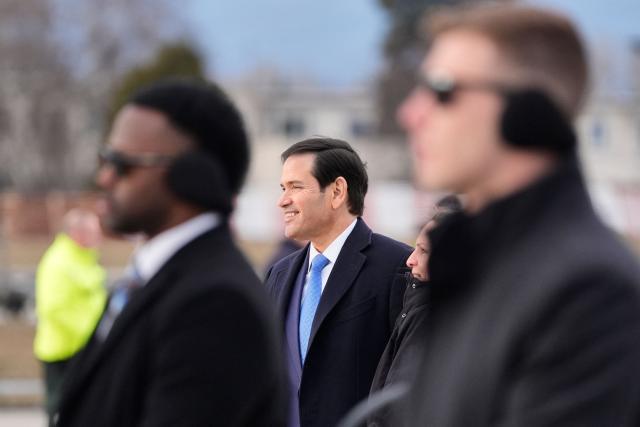 US Secretary of State Marco Rubio (C) smiles before his departure from Bratislava Airport in Bratislava, Slovakia, on February 15, 2026. (Photo by Alex Brandon / POOL / AFP)