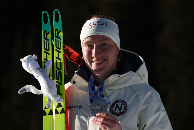 Silver medallist Norway's Maren Kirkeeide poses on the podium of the women's biathlon 10km pursuit event during the Milano Cortina 2026 Winter Olympic Games at the Anterselva Biathlon Arena (Sudtirol Arena) in Anterselva (Val Pusteria) on February 15, 2026. (Photo by FRANCK FIFE / AFP)