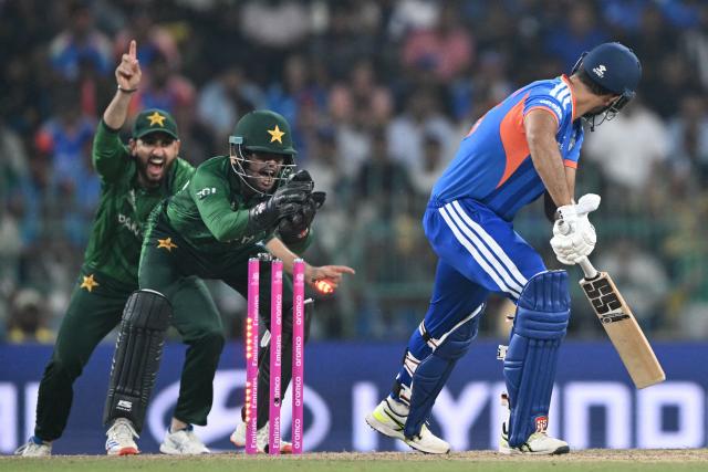 Pakistan's wicketkeeper Usman Khan (C) and captain Salman Agha (L) unsuccessfully appeal for leg before wicket (LBW) against India's Shivam Dube during the 2026 ICC Men's T20 Cricket World Cup group stage match between India and Pakistan at the R Premadasa Stadium in Colombo on February 15, 2026. (Photo by Ishara S.KODIKARA / AFP)