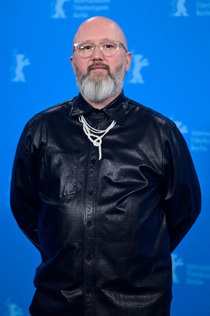 Belgian screenwriter Angelo Tijssens poses during a photo call for the film "Dust" presented in competition at the 76th Berlinale, Europe's first major film festival of the year, in Berlin on February 15, 2026. (Photo by John MACDOUGALL / AFP)