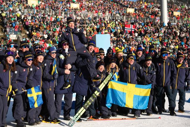 Gold medallist Sweden's Martin Ponsiluoma (above) poses with his teammates following the victory ceremony of the men's biathlon 12,5km pursuit event during the Milano Cortina 2026 Winter Olympic Games at the Anterselva Biathlon Arena (Sudtirol Arena) in Anterselva (Val Pusteria) on February 15, 2026. (Photo by Odd ANDERSEN / AFP)