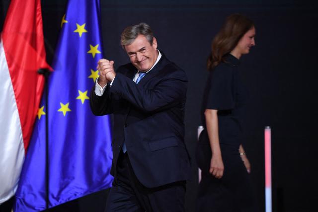 The Tisza party’s head of economic development and energy policy Istvan Kapitany (L) gestures as he delivers a speech on February 15, 2026 in Budapest, Hungary. (Photo by Ferenc ISZA / AFP)