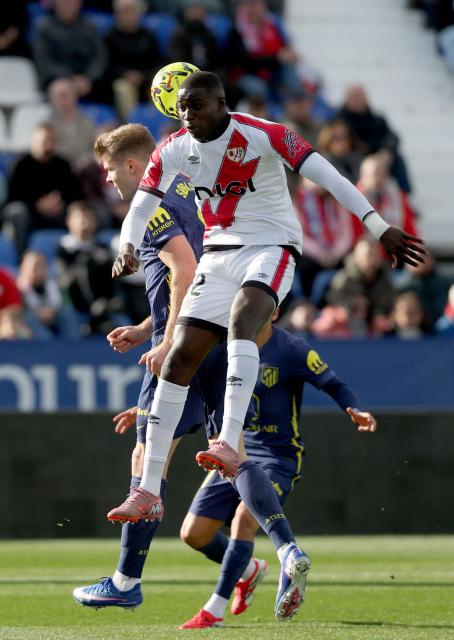Atletico Madrid's Norwegian forward #09 Alexander Sorloth fights for the ball with Rayo Vallecano's Senagalese defender #32 Nobel Mendy (up) during the Spanish league football match between Rayo Vallecano de Madrid and Club Atletico de Madrid at Vallecas Stadium in Madrid on February 15, 2026. (Photo by Pierre-Philippe MARCOU / AFP)