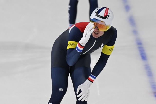 France's Valentin Thiebault reacts after his team was eliminated during the speed skating men's team pursuit quarter-final during the Milano Cortina 2026 Winter Olympic Games at Milano Speed Skating Stadium in Milan on February 15, 2026. (Photo by Daniel MUNOZ / AFP)