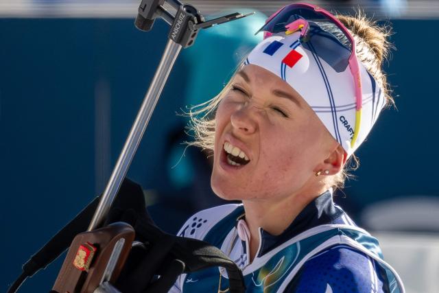 France's Oceane Michelon reacts while removing the rifle from her back at the shooting range during the women's biathlon 10km pursuit event during the Milano Cortina 2026 Winter Olympic Games at the Anterselva Biathlon Arena (Sudtirol Arena) in Anterselva (Val Pusteria) on February 15, 2026. (Photo by FRANCOIS-XAVIER MARIT / AFP)