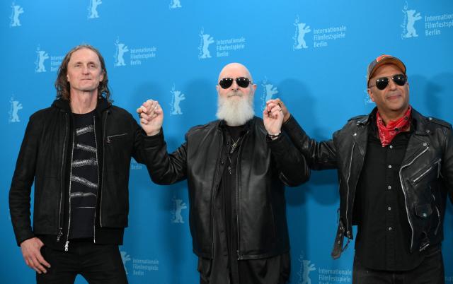 (From L) Canadian director Sam Dunn, Judas Priest singer and actor Rob Halford and former Rage Against the Machine guitarist and director Tom Morello pose during a photo call for the film 'The Ballad of Judas Priest' presented in Berlinale Special Gala at the 76th Berlinale, Europe's first major film festival of the year, in Berlin on February 15, 2026. (Photo by RALF HIRSCHBERGER / AFP)