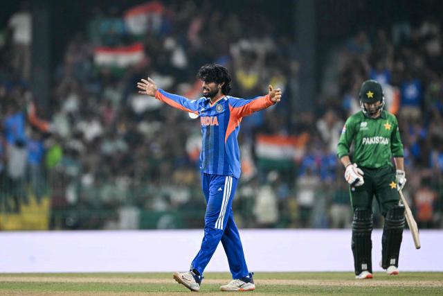 India's Tilak Varma celebrates after taking the wicket of Pakistan's Shadab Khan during the 2026 ICC Men's T20 Cricket World Cup group stage match between India and Pakistan at the R Premadasa Stadium in Colombo on February 15, 2026. (Photo by Ishara S.KODIKARA / AFP)