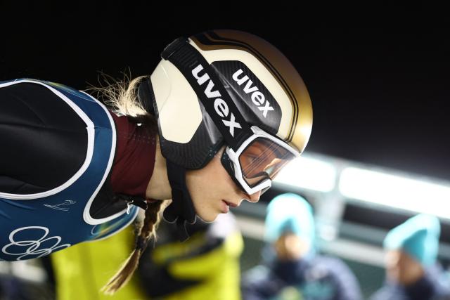 France's Pagnier Josephine prepares to jump during the trial round of the women's large hill individual ski jumping of the Milano Cortina 2026 Winter Olympic Games at Predazzo Ski Jumping Stadium in Predazzo (Val di Fiemme), on February 15, 2026. (Photo by Anne-Christine POUJOULAT / AFP)