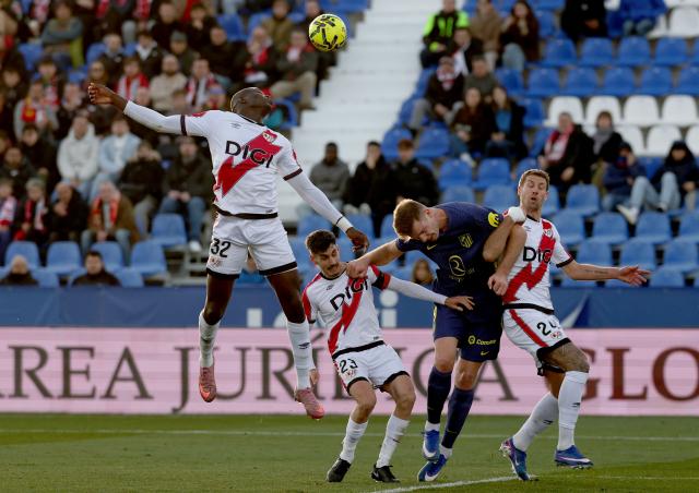 Rayo Vallecano's Senagalese defender #32 Nobel Mendy (up,L) fights for the ball with Atletico Madrid's Norwegian forward #09 Alexander Sorloth (2R) during the Spanish league football match between Rayo Vallecano de Madrid and Club Atletico de Madrid at Butarque Stadium in Leganes, south of Madrid on February 15, 2026. (Photo by Pierre-Philippe MARCOU / AFP)