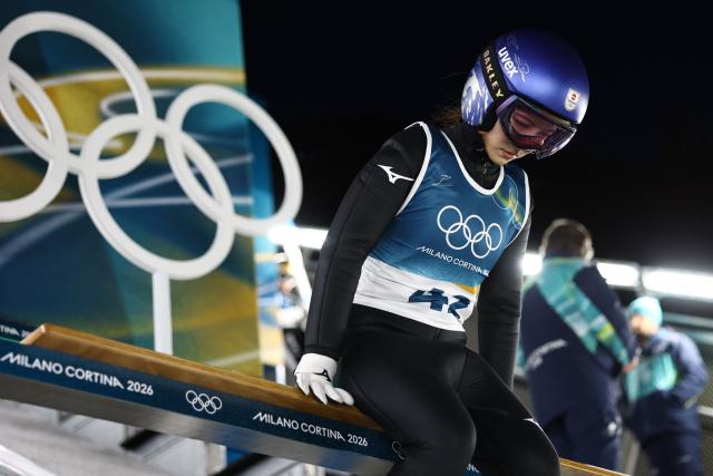 Japan's Sara Takanashi prepare to jump during the trial round of the women's large hill individual ski jumping of the Milano Cortina 2026 Winter Olympic Games at Predazzo Ski Jumping Stadium in Predazzo (Val di Fiemme), on February 15, 2026. (Photo by Anne-Christine POUJOULAT / AFP)