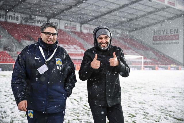 Westerlo's Belgian-Moroccan head coach Issame Charai (R) celebrates after winning at the end of the Belgian "Pro League" First Division football match between Antwerp and KVC Westerlo at Bosuil stadium in Antwerp on February 15, 2026. (Photo by Tom Goyvaerts / BELGA / AFP) / Belgium OUT