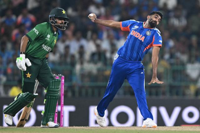 India's Jasprit Bumrah (R) delivers a ball during the 2026 ICC Men's T20 Cricket World Cup group stage match between India and Pakistan at the R Premadasa Stadium in Colombo on February 15, 2026. (Photo by Ishara S. KODIKARA / AFP)