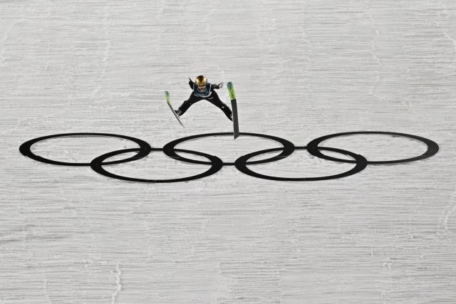 France's Emma Chervet jumps during the 1st round of the women's large hill individual ski jumping of the Milano Cortina 2026 Winter Olympic Games at Predazzo Ski Jumping Stadium in Predazzo (Val di Fiemme), on February 15, 2026. (Photo by Javier SORIANO / AFP)